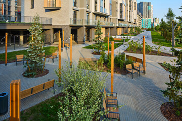 Fototapeta premium New modern block of flats in green area. residential apartment with flat buildings exterior. luxury house complex. Part of City Real estate property, condo architecture. apartment insurance concept