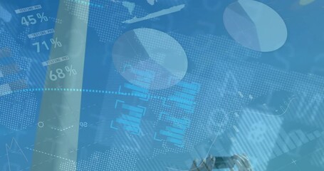 Field engineer raising smartphone and capturing wind turbine metrics with animated charts appearing - Powered by Adobe