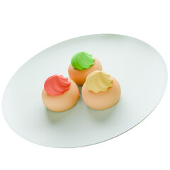 3D Three colorful cupcakes with pastel icing on a white plate, viewed from above with soft lighting and a clean minimal background.
