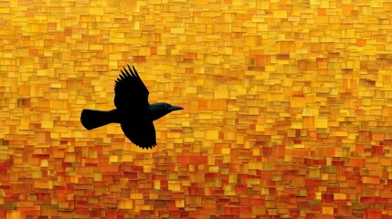 Naklejka premium Black bird silhouette flying against abstract golden and orange textured background