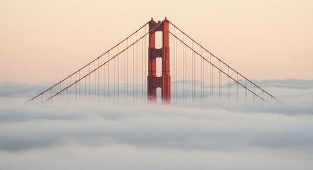 Golden gate bridge emerging from fog at sunrise, san francisco
