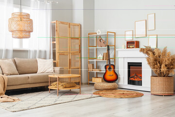 Interior of stylish living room with sofa, guitar and retro radio on fireplace