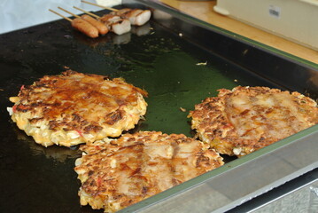 japanese okonomiyaki pancake on the grill