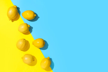 Fresh ripe lemons on colorful background