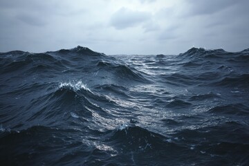 Dark, stormy ocean waves under a gray sky