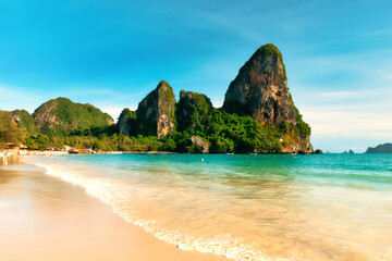 Railay Krabi Thailand : 03 August 2025 : Landscape of Traditional Thailand Long tail Boats on Railay Beach white sand and blue sea with limestone in Railay Ao nang Krabi Thailand - sunny afternoon.