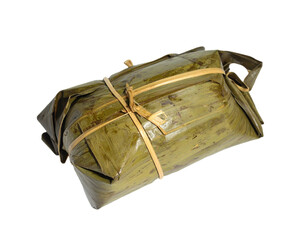 Authentic tamale wrapped in banana leaf, a delicious culinary delight waiting to be savored.