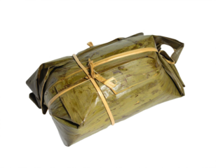 Authentic tamale wrapped in banana leaf, a delicious culinary delight waiting to be savored.