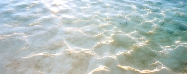 Sunlight through clear ocean water ripples abstract pattern