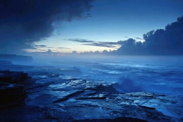 Obraz premium Dramatic coastal scene at dawn, dark blue hues