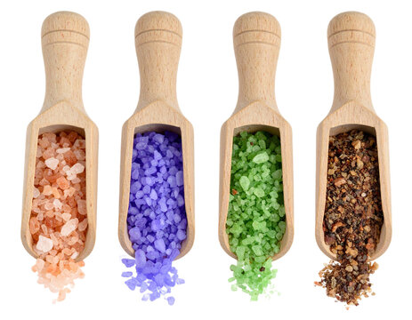 Four wooden scoops brimming with colorful bath salts and spices, ready for relaxation and culinary delight
