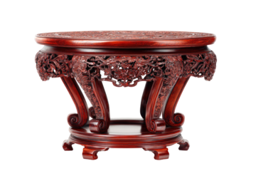 Ornate, round, wooden table with intricate carvings.  Deep red hue