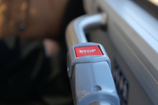 Bus stop button on public transport in urban setting