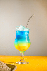Tropical gradient cocktail , summer beach drink, refreshing and colorful
