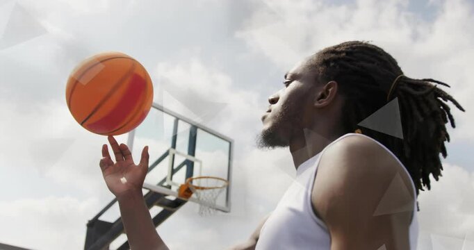 Player giving upward flick and spinning basketball beneath hoop teaching spin control for education