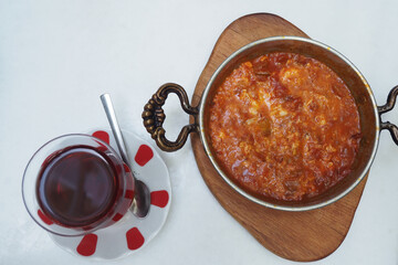 Traditional dish served with tea in a cozy setting