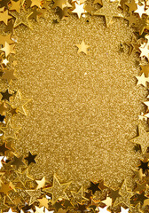 Abstract Golden Stars Frame Against Glittery Sparkling Background Photo