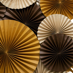 Abstract Paper Fan Background Brown Gold and Beige Tones Studio Shot