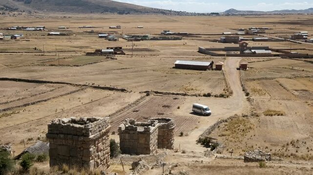 Discover the expansive archaeological site of Chullpas de Molloco in Peru, featuring ancient pre-Inca burial towers set within a vast, rural Andean landscape.
