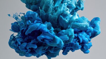 Abstract Blue Ink Swirl in Water Creating Artistic Texture for Creative Backgrounds and Colorful Designs