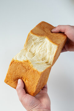 Close-up of torn toast details with white space