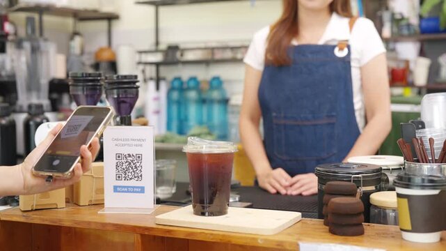 Small business entrepreneur coffee shop barista cafe restaurant. Customer buy beverage using credit card on smartphone app scan QR code at cashier counter making online banking payment at coffee shop. - Powered by Adobe