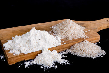 flour and rice on the wooden table with a background ...