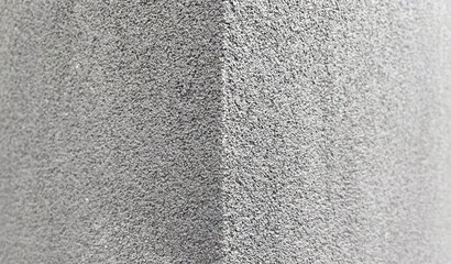 A Simple Uniform Grey Concrete Siding on a Building