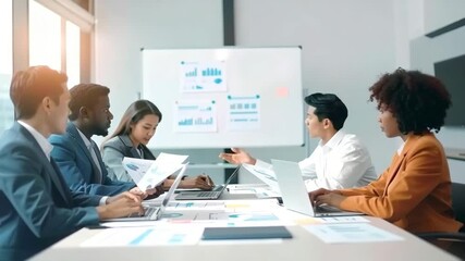 Dynamic diverse team analyzing business data, collaborating at modern office conference table - Powered by Adobe