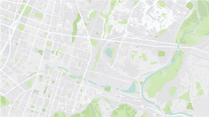 Fototapeta premium Vector aerial view of a city map with grid like street patterns and green spaces and a winding river visible