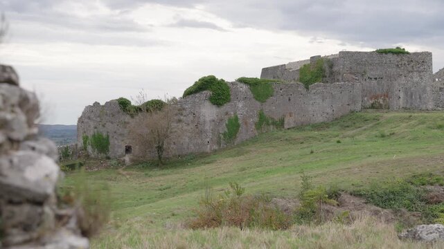 Historic stone walls of Rozafa Castle in Shkoder, Albania on a cloudy day