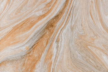 Abstract pattern on the vitrified tile with brown streaks for background use.