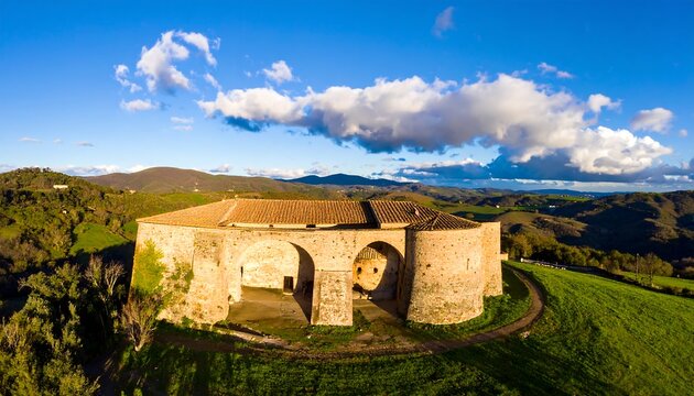 Panoramic view of a stone structure on a hillside