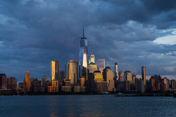 Obraz premium New York City. NYC skyline with towering skyscrapers. Manhattan and Hudson River. Panoramic cityscape of New York. Downtown NYC with landmarks. New York skyline. New York reflecting skyscrapers.