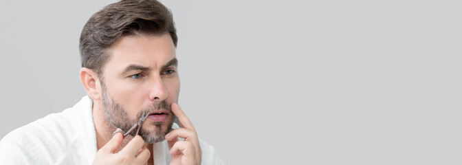 Man advertising cosmetics cream for male skin care. Cream for male skin. Mens skincare. Isolated studio banner. Organic cosmetics for man. Natural man holding cosmetic for skincare.