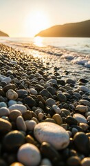 Pebble Beach Shoreline at Sunset with Gentle Waves