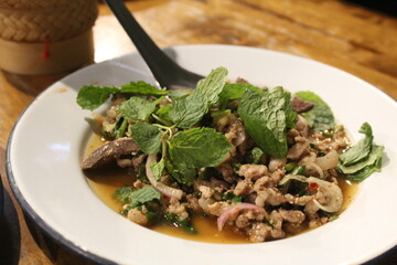 Larb is a spicy minced pork dish in E-san cuisine