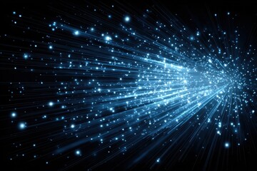 Abstract explosion of glowing blue light particles and streaks on black background