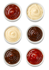 Isolated Sauces in White Bowls on Black Background Photo