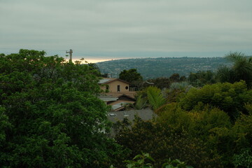 Beautiful San Diego home with a view of sunset during golden hour, nestled in trees