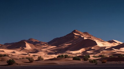 Naklejka premium Desert dunes under moonlight