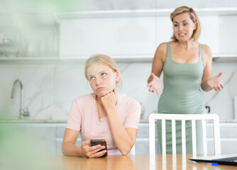 Mother is outraged by childs long screen time. Woman screams and swears at teenager for aimlessly...