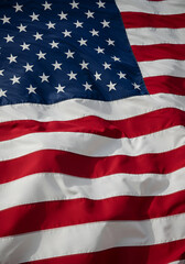 Obraz premium Photo of American Flag with Stripes and Stars Waving in The Wind