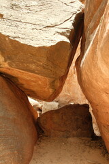 Pile of rocks creating a tunnel at Lower Pine Creek Waterfall Trail zion national park utah during summer time