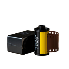 Photographic Film and Camera on Isolated Background Photo