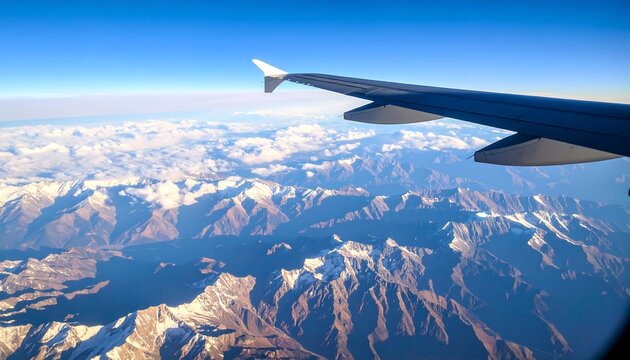 Aerial view of mountains and clouds from an airplane