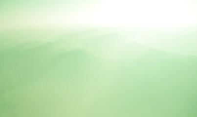 Obraz premium Green tinted misty mountain range scenery