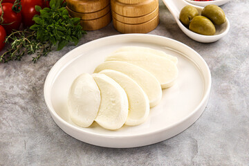 Organic mozzarella cheese slices in the plate