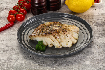 Baked cod fish fillet with spices