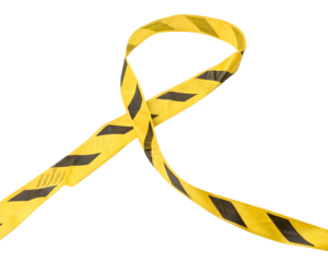 Yellow and black caution tape twisted in a loop on a transparent background. The tape is commonly used for safety and warning purposes.